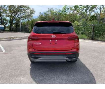2023 Hyundai Santa Fe SE is a Red 2023 Hyundai Santa Fe SE SUV in New Port Richey FL