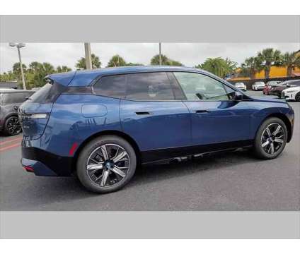 2024 BMW iX xDrive50 is a Blue 2024 BMW 325 Model iX SUV in Jacksonville FL