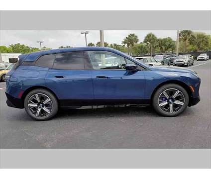 2024 BMW iX xDrive50 is a Blue 2024 BMW 325 Model iX SUV in Jacksonville FL