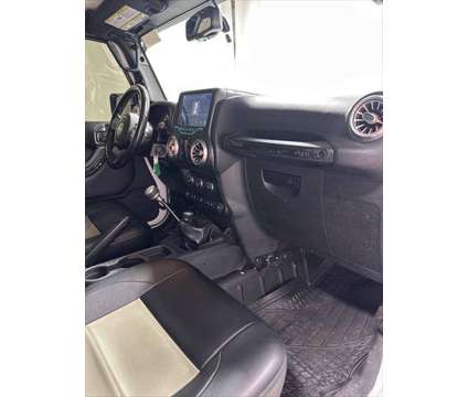 2016 Jeep Wrangler Sahara is a White 2016 Jeep Wrangler Sahara SUV in Pikeville KY