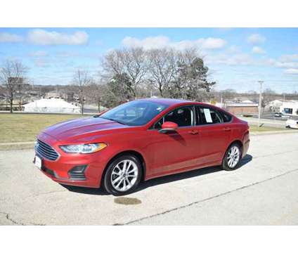 2020 Ford Fusion Hybrid SE is a Red 2020 Ford Fusion Hybrid SE Hybrid in Lombard IL