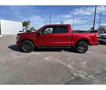 2023 Ford F-150 Lariat is a Red 2023 Ford F-150 Lariat Truck in Little River SC