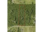 10 Heavily Wooded Acre Homesite with Outbuilding!