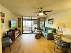 End Unit 2 bedroom 2 bath condo with enclosed lanai convenient to Punahou and