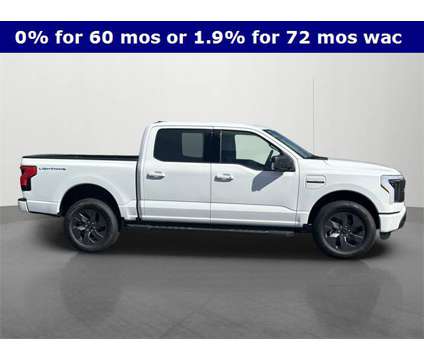 2023 Ford F-150 Lightning XLT is a White 2023 Ford F-150 XLT Truck in Roanoke IL