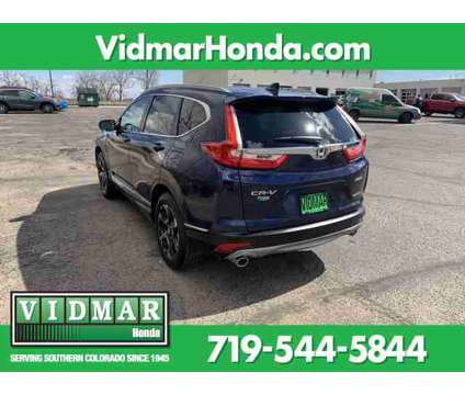 2019 Honda CR-V Touring is a Blue 2019 Honda CR-V Touring SUV in Pueblo CO