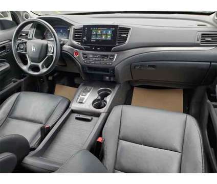 2021 Honda Pilot AWD EX-L is a Black 2021 Honda Pilot SUV in Brunswick OH