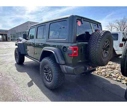 2024 Jeep Wrangler Willys is a Green 2024 Jeep Wrangler Car for Sale in Pataskala OH
