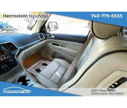 2014 Jeep Grand Cherokee Overland is a Tan 2014 Jeep grand cherokee Overland SUV in Chillicothe OH