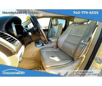 2014 Jeep Grand Cherokee Overland is a Tan 2014 Jeep grand cherokee Overland SUV in Chillicothe OH