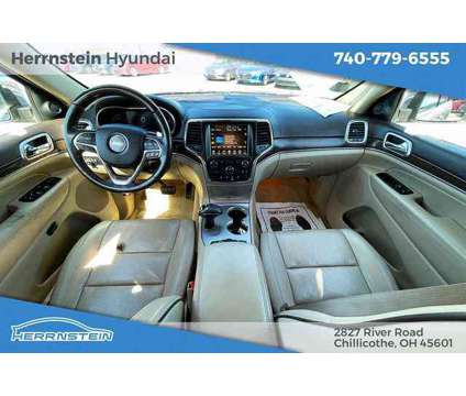 2014 Jeep Grand Cherokee Overland is a Tan 2014 Jeep grand cherokee Overland SUV in Chillicothe OH