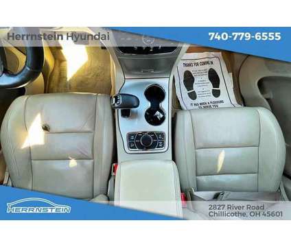 2014 Jeep Grand Cherokee Overland is a Tan 2014 Jeep grand cherokee Overland SUV in Chillicothe OH