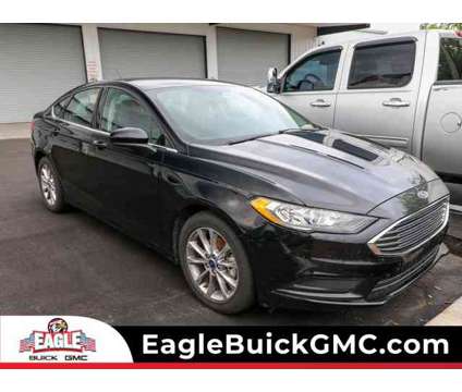 2017 Ford Fusion SE is a Black 2017 Ford Fusion SE Car for Sale in Homosassa FL