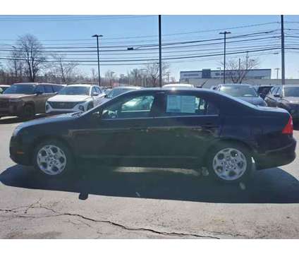 2011 Ford Fusion SE is a Black 2011 Ford Fusion SE Sedan in Brunswick OH