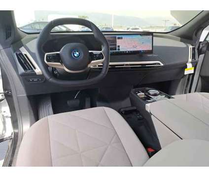 2024 BMW iX xDrive50 is a White 2024 BMW 325 Model iX SUV in Alhambra CA