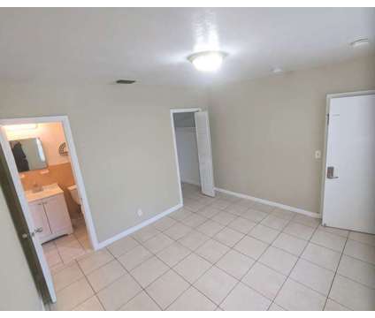 Master bedroom with a private bathroom at 196 Nw 34th Ave in Lauderhill FL is a Roommate