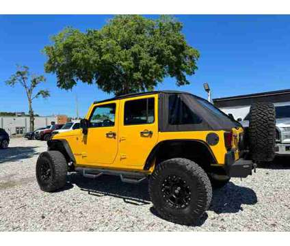 2015 Jeep Wrangler for sale is a Yellow 2015 Jeep Wrangler Car for Sale in Tampa FL