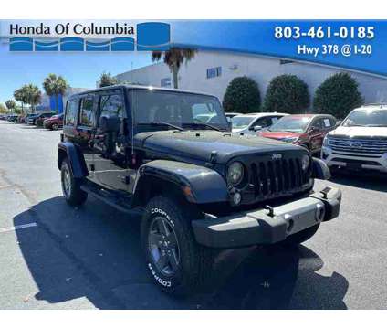 2015 Jeep Wrangler Unlimited Freedom Edition is a Black 2015 Jeep Wrangler Unlimited SUV in Lexington SC