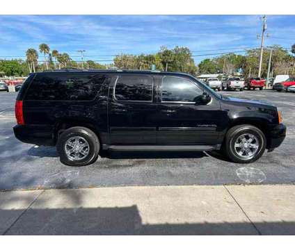 2013 GMC Yukon XL 1500 for sale is a Black 2013 GMC Yukon XL 1500 Trim Car for Sale in Port Orange FL