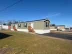 This manufactured home boasts a two-bedroom, two-bathroom