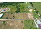 Grove, 1/2 Acre lot in the Industrial annex just east of the