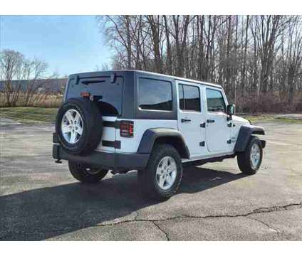 2015 Jeep Wrangler Unlimited Sport is a White 2015 Jeep Wrangler Unlimited SUV in Freeport IL