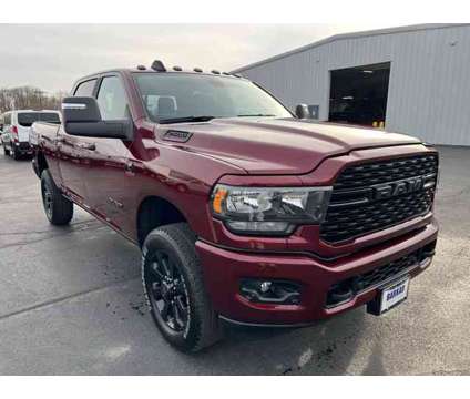 2024 Ram 2500 Big Horn is a Red 2024 RAM 2500 Model Big Horn Truck in Freeport IL