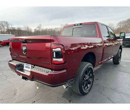 2024 Ram 2500 Big Horn is a Red 2024 RAM 2500 Model Big Horn Truck in Freeport IL