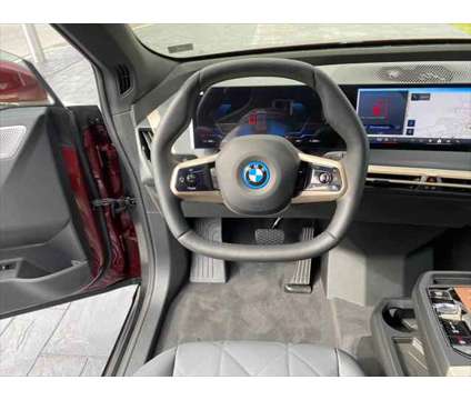 2024 BMW iX M60 is a Red 2024 BMW 325 Model iX SUV in Mechanicsburg PA