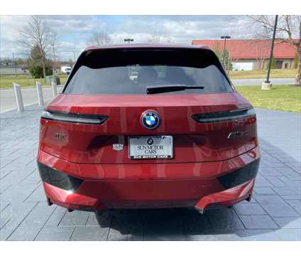 2024 BMW iX M60 is a Red 2024 BMW 325 Model iX SUV in Mechanicsburg PA
