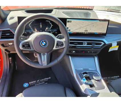 2024 BMW i4 xDrive40 is a Orange 2024 Sedan in Loveland CO