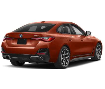 2024 BMW i4 xDrive40 is a Orange 2024 Sedan in Loveland CO