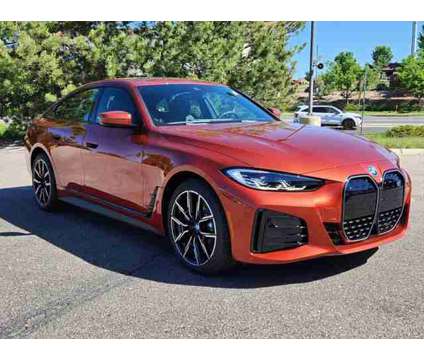 2024 BMW i4 xDrive40 is a Orange 2024 Sedan in Loveland CO