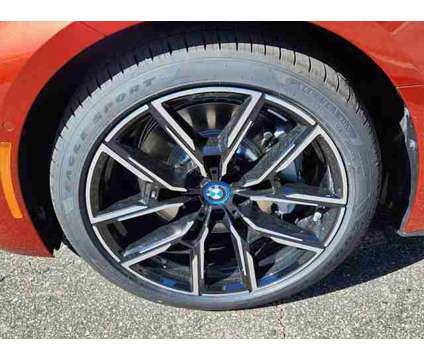 2024 BMW i4 xDrive40 is a Orange 2024 Sedan in Loveland CO