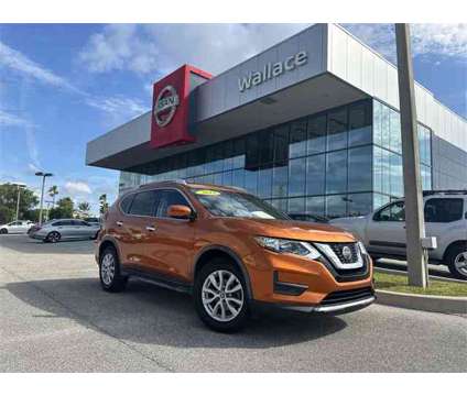 2018 Nissan Rogue SV is a Orange 2018 Nissan Rogue SV SUV in Stuart FL