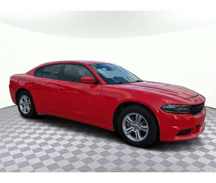 2021 Dodge Charger SXT is a Red 2021 Dodge Charger SXT Sedan in Lake City FL