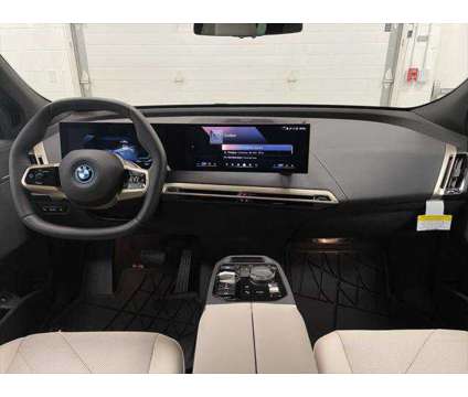 2024 BMW iX xDrive50 is a Blue 2024 BMW 325 Model iX SUV in Erie PA