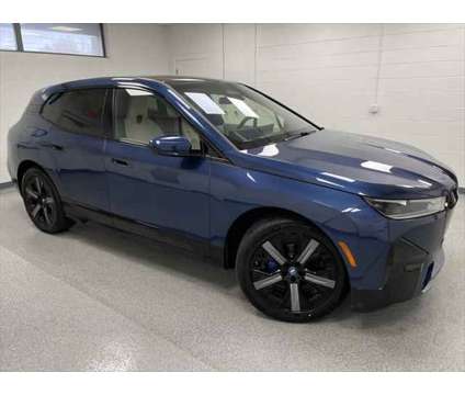 2024 BMW iX xDrive50 is a Blue 2024 BMW 325 Model iX SUV in Erie PA
