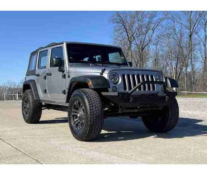 2014 Jeep Wrangler for sale is a Silver 2014 Jeep Wrangler Car for Sale in Jackson MO
