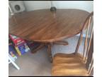Beautiful all-wooden table and 6 chairs with leaf
