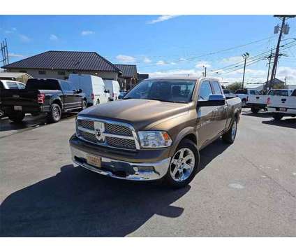 2011 Ram 1500 Quad Cab for sale is a Brown 2011 RAM 1500 Model Car for Sale in Abilene TX