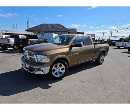 2011 Ram 1500 Quad Cab for sale is a Brown 2011 RAM 1500 Model Car for Sale in Abilene TX