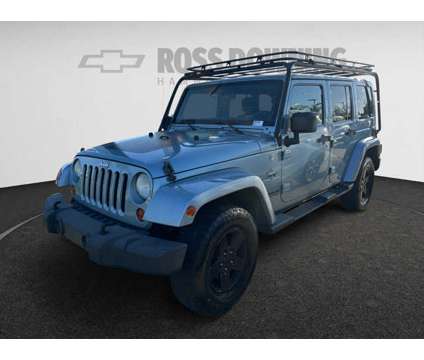 2012 Jeep Wrangler Unlimited Arctic 4X4 is a White 2012 Jeep Wrangler Unlimited Car for Sale in Hammond LA