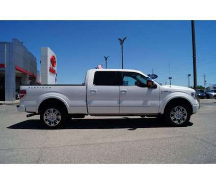 2013 Ford F-150 Platinum is a White 2013 Ford F-150 Platinum Car for Sale in Hutchinson KS