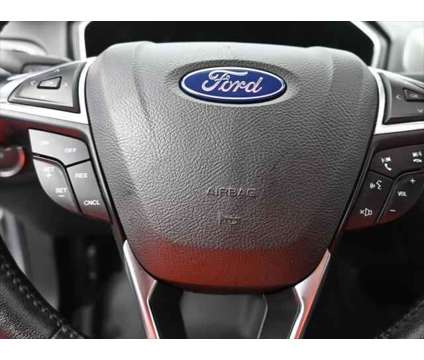 2020 Ford Fusion SEL is a Silver 2020 Ford Fusion SEL Sedan in Dubuque IA