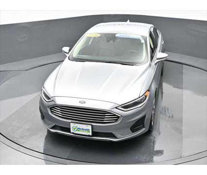 2020 Ford Fusion SEL is a Silver 2020 Ford Fusion SEL Sedan in Dubuque IA