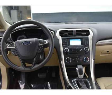 2015 Ford Fusion SE is a Black 2015 Ford Fusion SE Sedan in Mcdonough GA