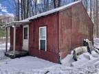 Harrison, Family owned acreage with small hunting cabin that