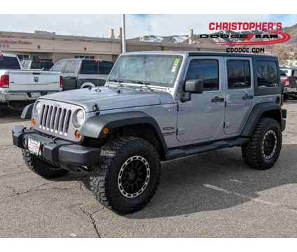 2013 Jeep Wrangler Unlimited Sport is a Silver 2013 Jeep Wrangler Unlimited Sport Car for Sale in Golden CO