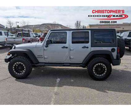 2013 Jeep Wrangler Unlimited Sport is a Silver 2013 Jeep Wrangler Unlimited Sport Car for Sale in Golden CO